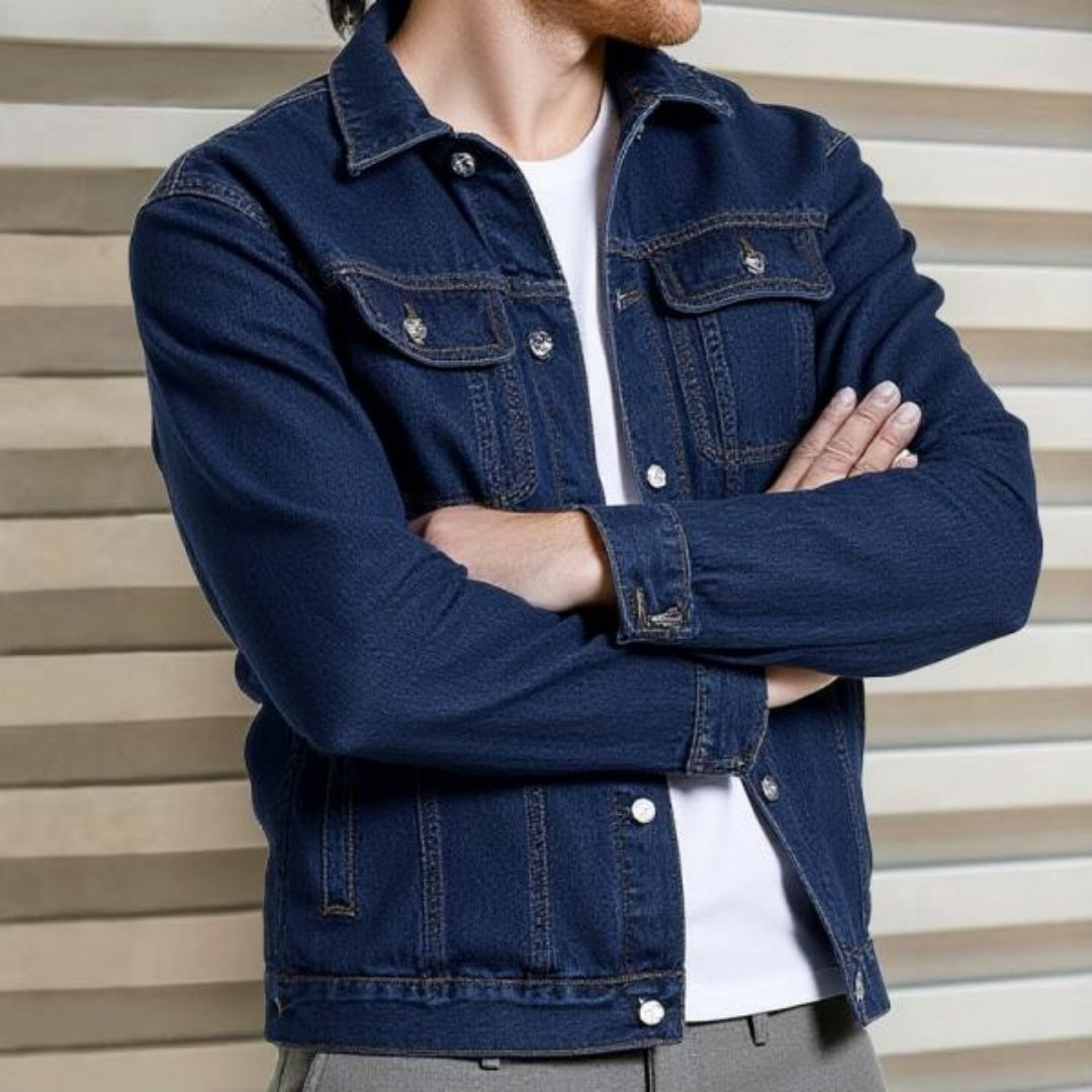 Dark indigo denim trucker jacket worn open with light jeans
