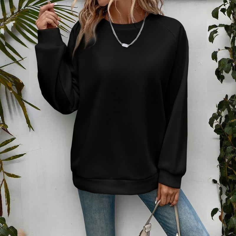 Black relaxed crewneck sweatshirt with raglan sleeves, front view