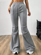 Gray flare sweatpants with drawstring waist and front seams