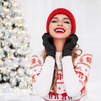 Black knit gloves worn with a red beanie and winter sweater