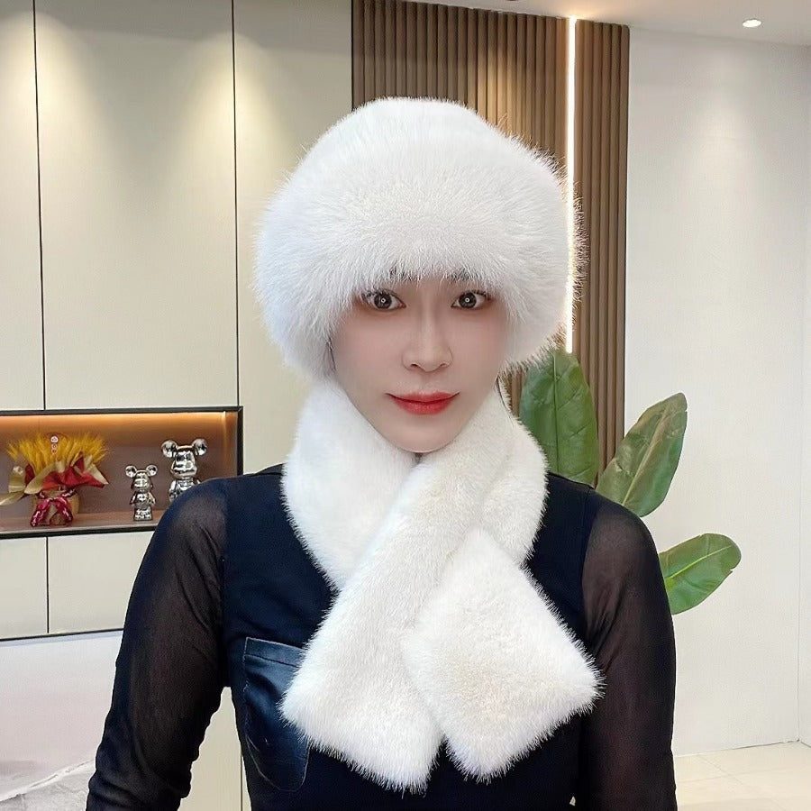 Milky white faux fur hat and pull-through scarf set worn together