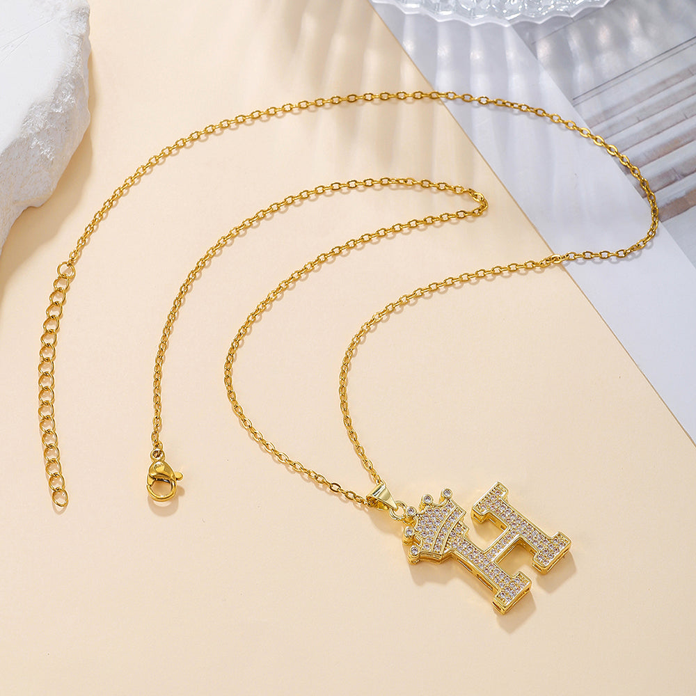 Gold tone crown letter H pendant necklace
