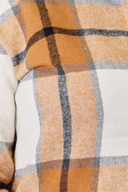 Close up of the tan, orange and white plaid fabric