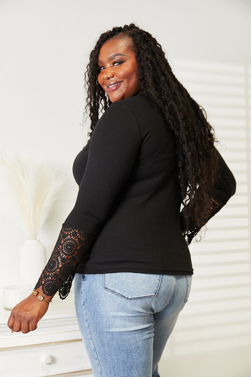 Lace Sleeve Henley Top in black on a second model, back view
