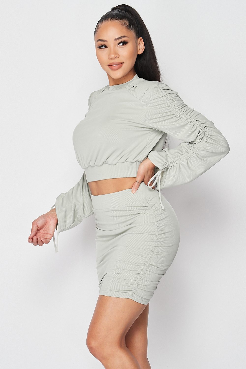 Dusty mint ruched crop top and mini skirt set, three-quarter view