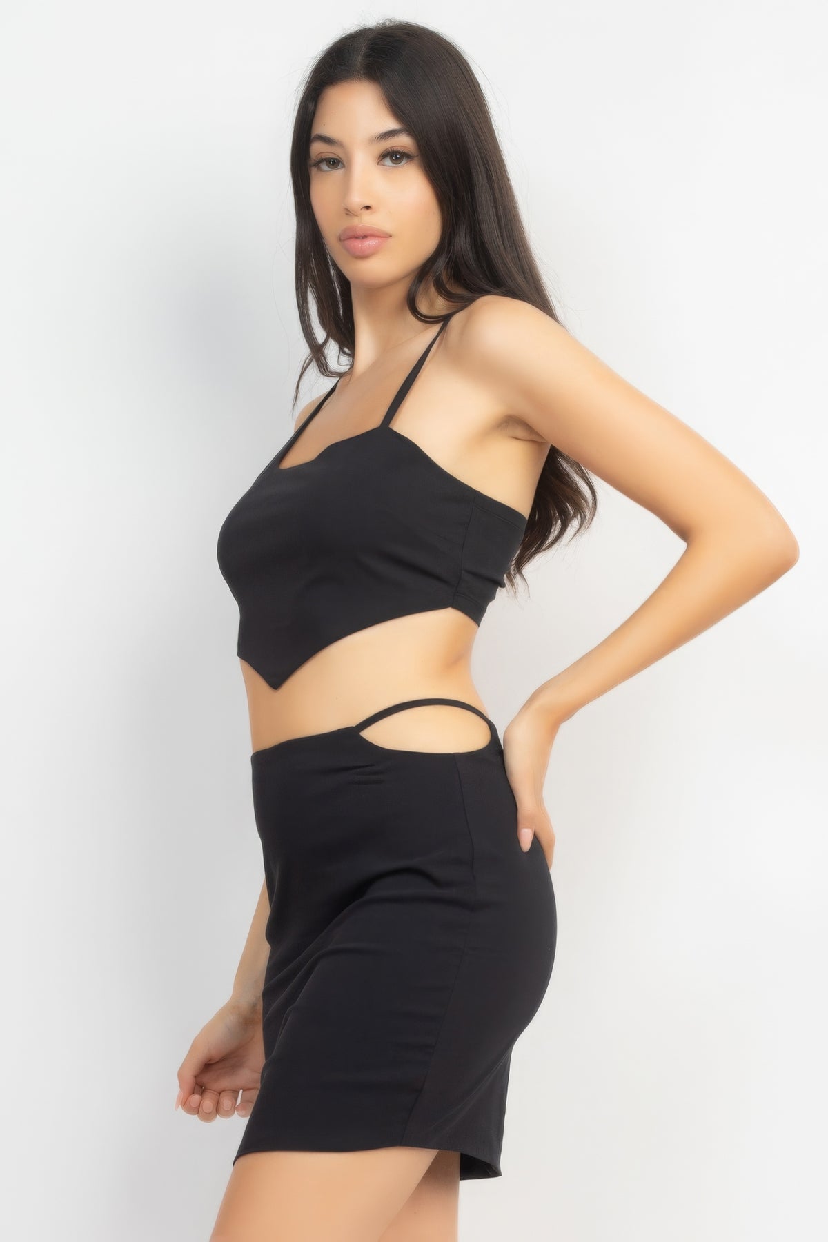Black crop tank and skirt with side cutout, angled view