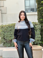Color block knit pullover, front view with hands on hips