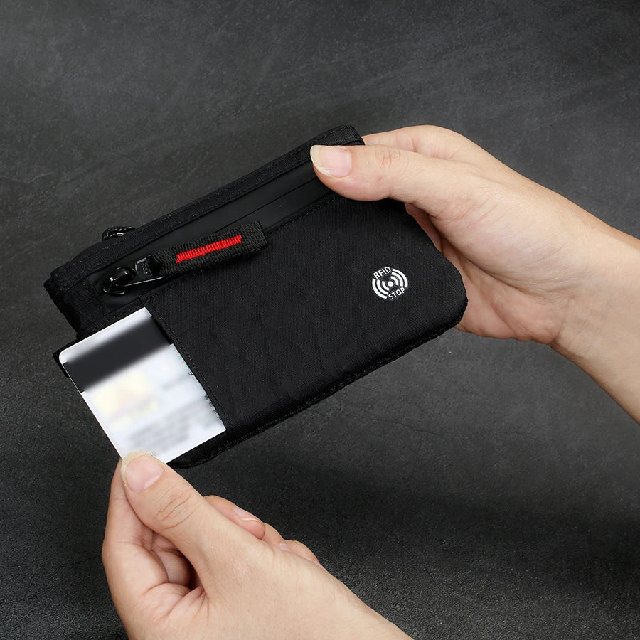 RFID Zip Card Holder, sliding a card into the front pocket