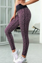 Purple leopard print leggings with black waistband, front view
