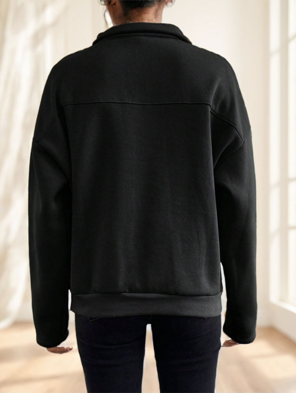 Black oversized pullover sweatshirt, back view