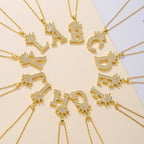 Crown initial letter pendant necklaces in gold tone with zircon