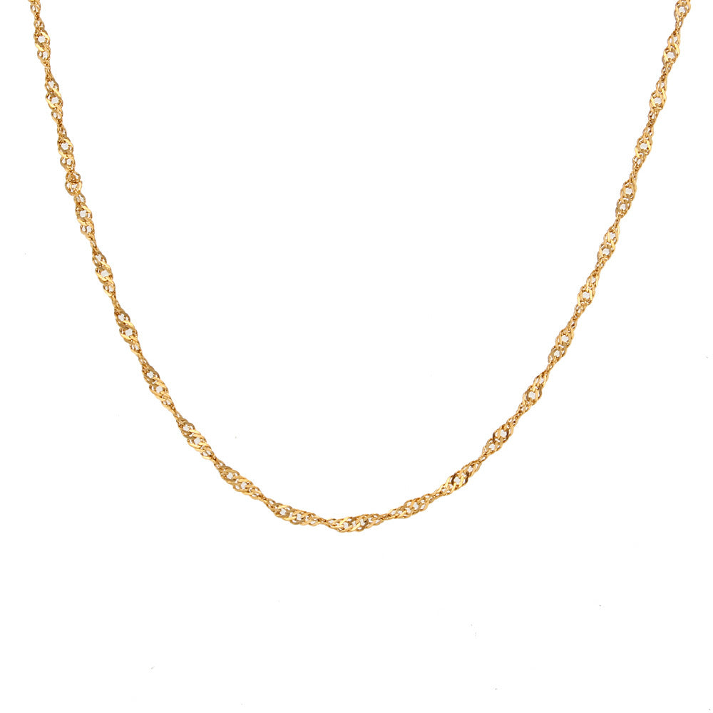 Gold tone water wave chain necklace laid flat